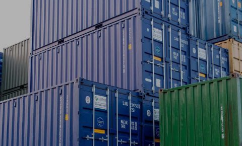 containers stacked blue green red