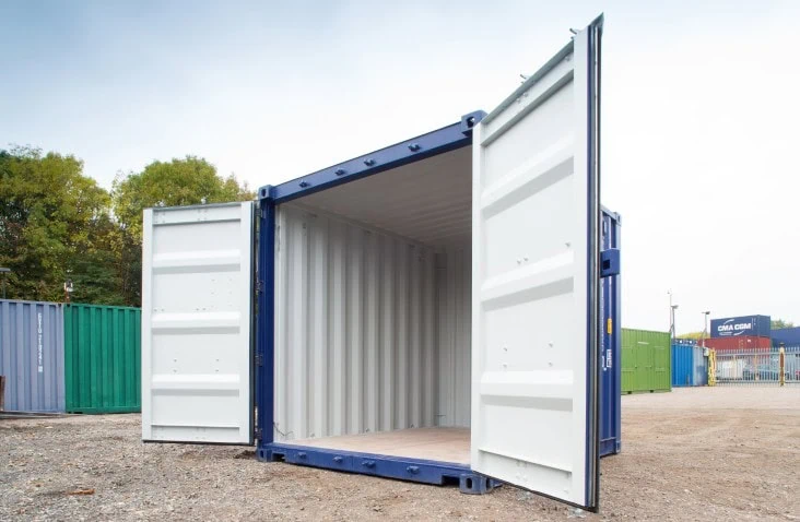 10ft blue shipping container with both doors open, showing white painted interior walls and plywood flooring.