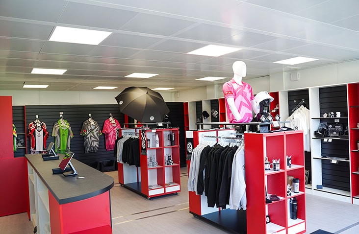 Modular hospitality and pop-up retail unit with shop fittings, display shelving and branded merchandise for events and commercial use.