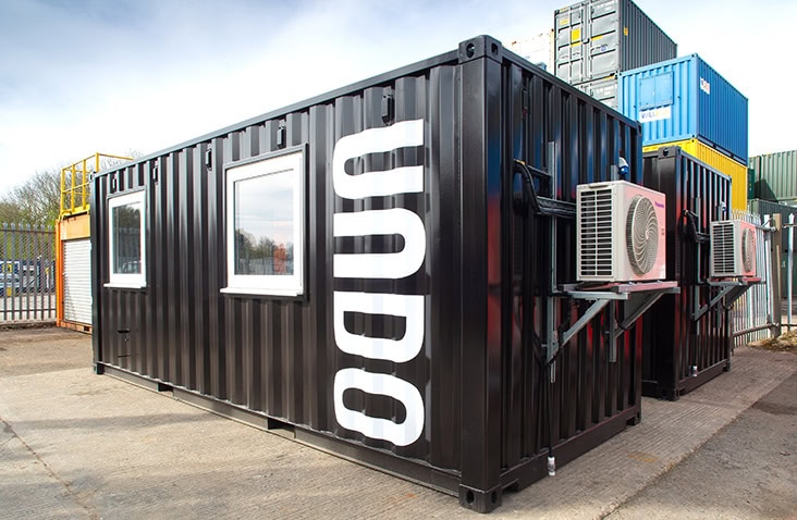 A fully weatherproofed and insulated 20ft container laboratory with integrated electrical and water systems and airtight doors/windows.
