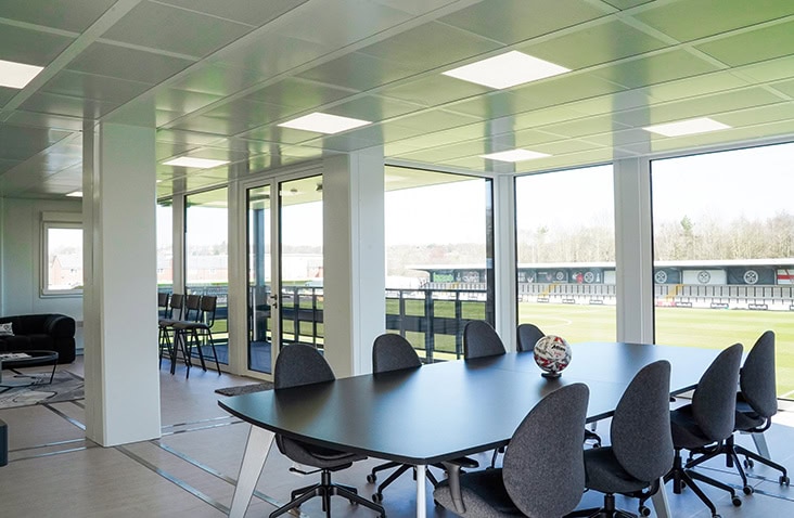 Modular office unit with meeting room, desks and large windows providing professional on-site workspace for businesses and projects.