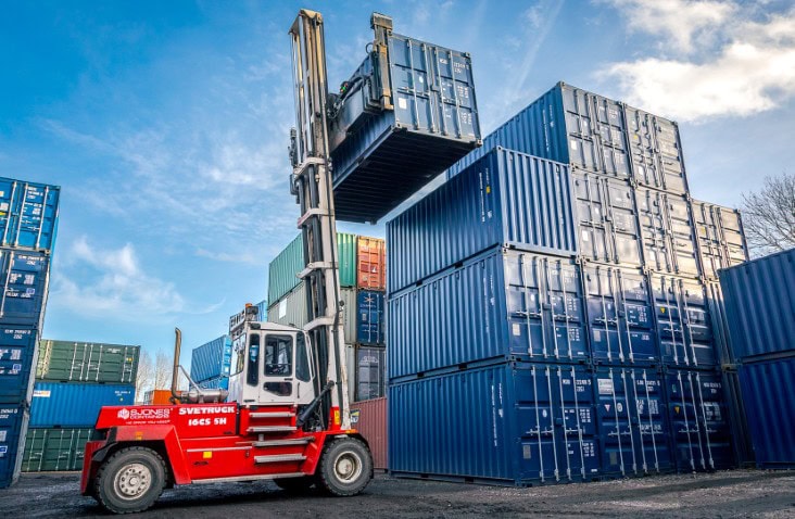 S Jones Containers forklift truck moving shipping containers at the Aldridge, Walsall depot for container hire, sales, and storage