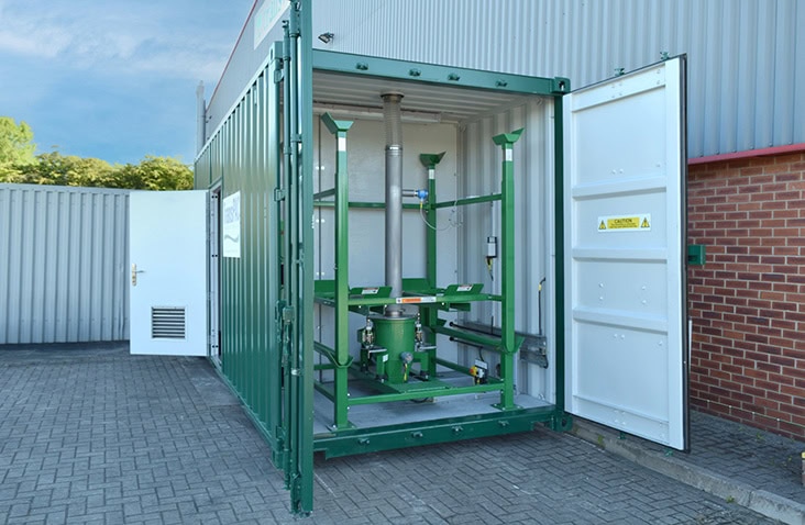 Internal corridor view inside a modular building, showing a clean, modern interior with integrated lighting, smooth wall finishes and glazed external doors providing access to outdoor space.