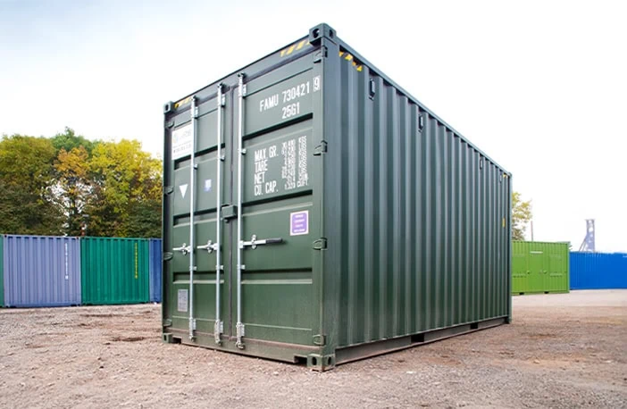 Green 20ft high cube shipping container for sale, providing extra height for storage or transport, pictured on a container yard