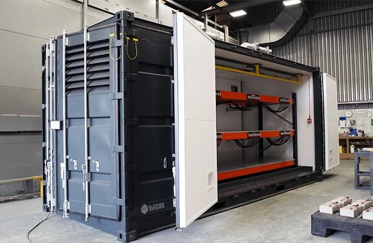 Lead-acid battery charging container with full-length access doors and internal racking system, engineered and manufactured by S Jones Conversions.