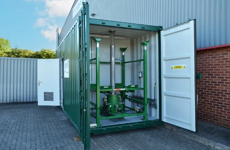 20ft double end-opening container conversion for water treatment equipment, showing open cargo doors revealing internal PAC dosing and process equipment mounted within a converted shipping container.