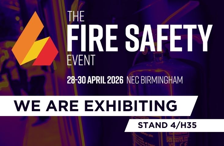 Promotional graphic for The Fire Safety Event at NEC Birmingham, 28–30 April 2026, announcing “We Are Exhibiting” with stand number 4/H35, alongside the event logo and a blurred background image of fire safety equipment.