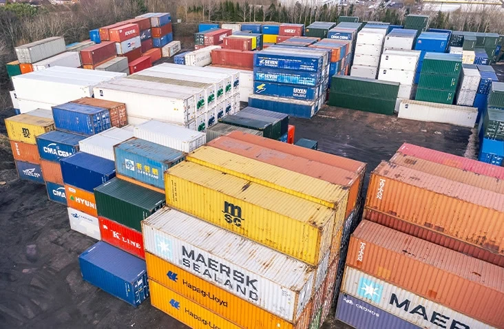 Aerial view of the S Jones Containers depot in Aldridge, West Midlands, showing a large stock of new and used shipping containers in a range of sizes and specifications, ready for sale, hire, conversion, repair, and nationwide delivery across Great Britain.